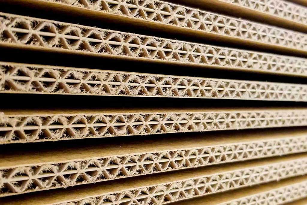 Corrugated packaging manufacturing equipment, utilizing Zenith Cutter industrial knives for precise cutting operations.